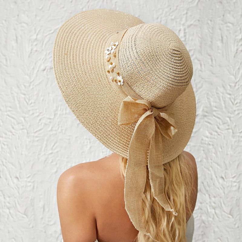 Femmes Paille Couleur Unie Élégant Grand Bord Perle Nœud Papillon Bord Ondulé Visière Chapeau De Soleil Chapeau De Plage Chapeau Seau