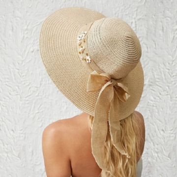 Femmes Paille Couleur Unie Élégant Grand Bord Perle Nœud Papillon Bord Ondulé Visière Chapeau De Soleil Chapeau De Plage Chapeau Seau