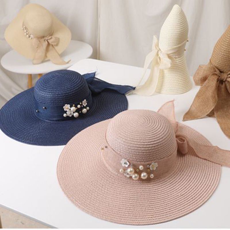 Femmes Paille Couleur Unie Élégant Grand Bord Perle Nœud Papillon Bord Ondulé Visière Chapeau De Soleil Chapeau De Plage Chapeau Seau