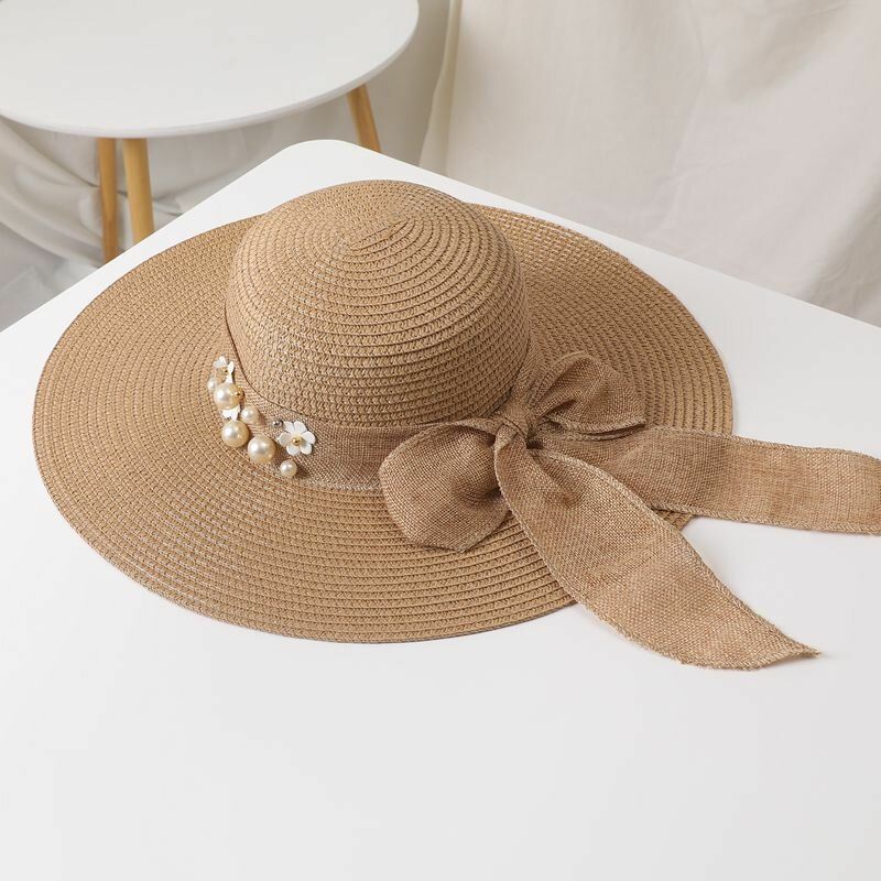 Femmes Paille Couleur Unie Élégant Grand Bord Perle Nœud Papillon Bord Ondulé Visière Chapeau De Soleil Chapeau De Plage Chapeau Seau