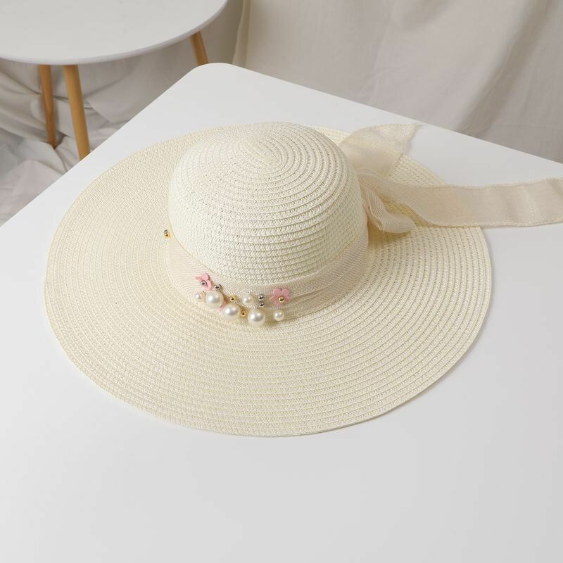 Femmes Paille Couleur Unie Élégant Grand Bord Perle Nœud Papillon Bord Ondulé Visière Chapeau De Soleil Chapeau De Plage Chapeau Seau