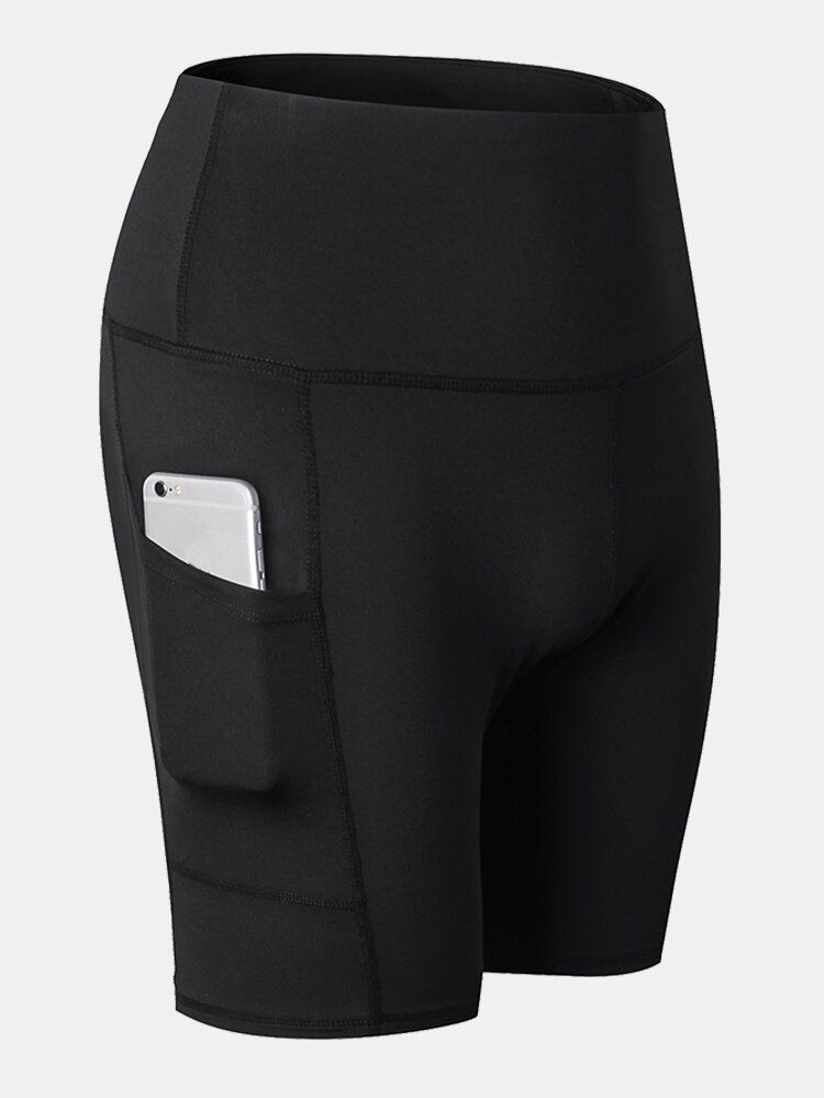 Short De Sport De Yoga À Séchage Rapide De Couleur Unie Pour Femmes Avec Poche Latérale