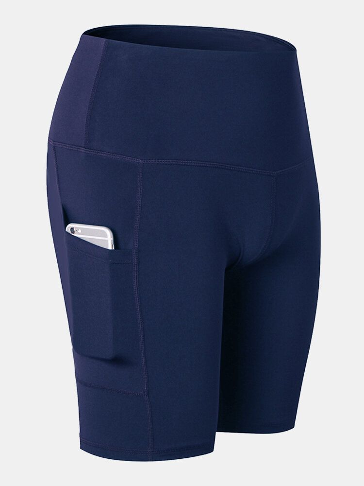 Short De Sport De Yoga À Séchage Rapide De Couleur Unie Pour Femmes Avec Poche Latérale