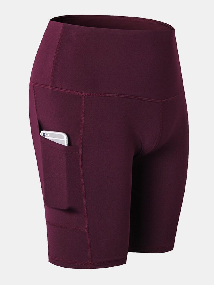 Short De Sport De Yoga À Séchage Rapide De Couleur Unie Pour Femmes Avec Poche Latérale